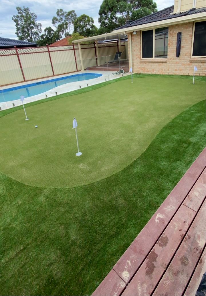 Backyard putting green with 4 holes